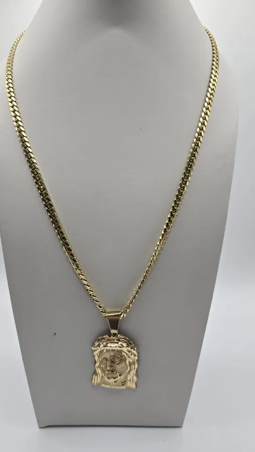 Christ pendant on solid Cuban link chain, 10K gold