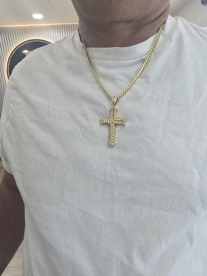 Solid Cuban link chain with cross pendant, worn